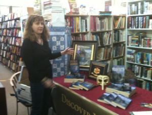 This is Tonya Macalino demonstrating how to set up an author's table for book signings and fairs.